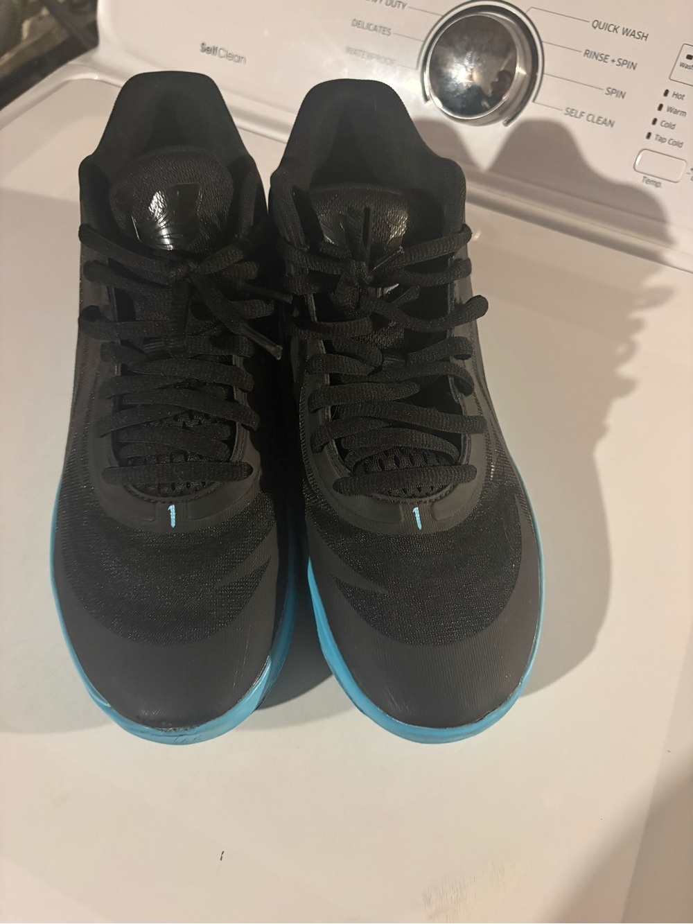 Nike Men's Black Athletic Shoes with Blue Sole